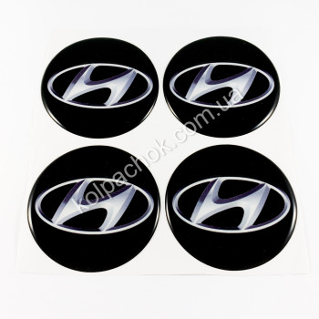 Наклейки для ковпачків на диски Hyundai чорні/білий лого (70мм) Наклейки для ковпачків на диски Hyundai чорні/білий лого (70мм)