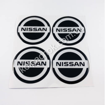Наклейки для ковпачків на диски Nissan чорний/білий лого (70мм) Наклейки для ковпачків на диски Nissan чорний/білий лого (70мм)