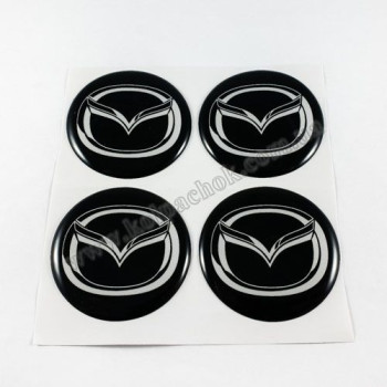 Наклейки для ковпачків на диски Mazda чорні/білий лого (45мм) Наклейки для ковпачків на диски Mazda чорні/білий лого (45мм)