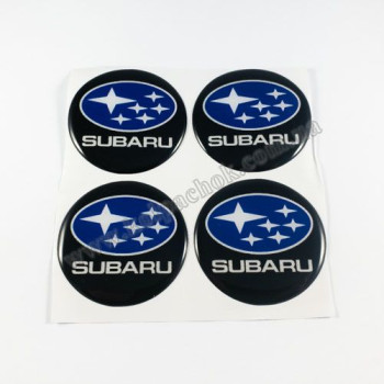 Наклейки для ковпачків на диски Subaru чорні/синій лого (55мм) Наклейки для ковпачків на диски Subaru чорні/синій лого (55мм)